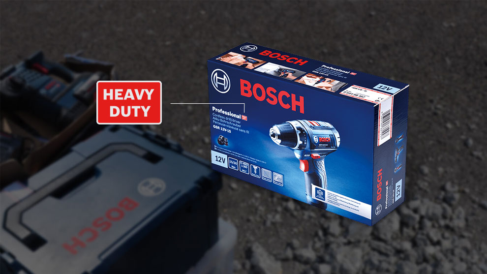 บรรจุภัณฑ์สว่านไร้สาย Bosch Professional วางอยู่บนพื้นหลังที่มืด.