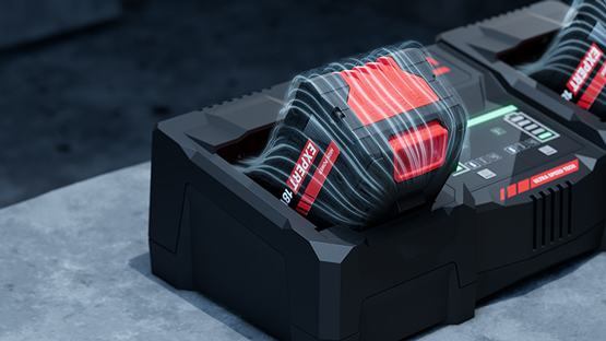 แบตเตอรี่ Bosch Professional สีแดงสองก้อนบนที่ชาร์จสีดำ.